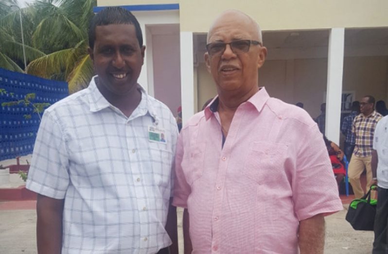 Branch Manager Premaul Ritney with Chairman of Banks DIH, Clifford Reis at the Annual General Meeting in Essequibo on Sunday
