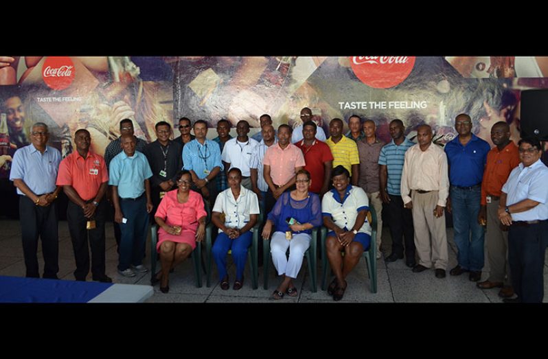 Mr. George Mc Donald, Co-Managing Director/Marketing Director (third right) strikes a pose with the awardees and senior executives of the Company