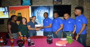 Shimron Hetmyer West Indies Under-19 captain and Aqua Mist Brand Ambassador hands over sponsorship to Guyana Fitness Games Jamie McDonald (third from left) last evening while other sponsors and organisers look on (Cullen Bess-Nelson photo)
