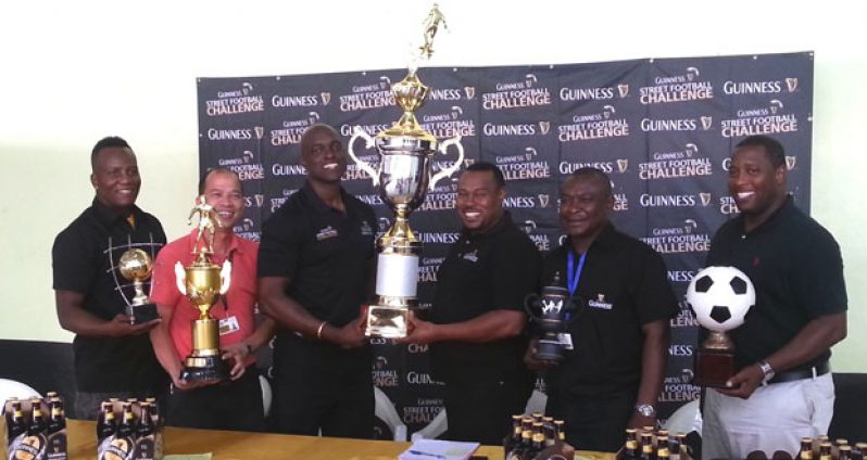 Banks DIH’s Guinness Brand Manager Lee Baptiste (3rd from left) presents Petra Organization’s Troy Mendonca with the championship trophy for this year’s Georgetown leg of the Guinness ‘Greatest of the Streets’ tournament. Also in photo from left are Wayne Griffith, Brian Choo, Troy Peters and Mortimer Stewart.