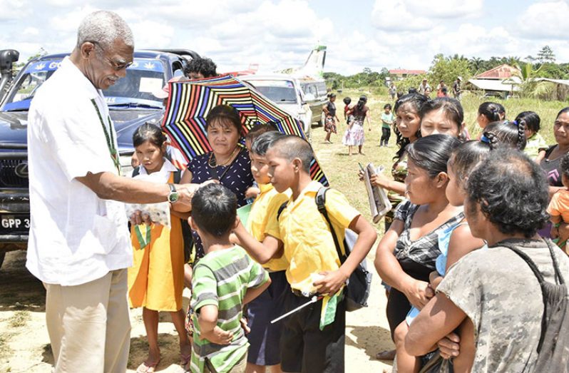 Residents gathered at a school in Baramita during Wednesday’s visit by President David Granger (MotP)