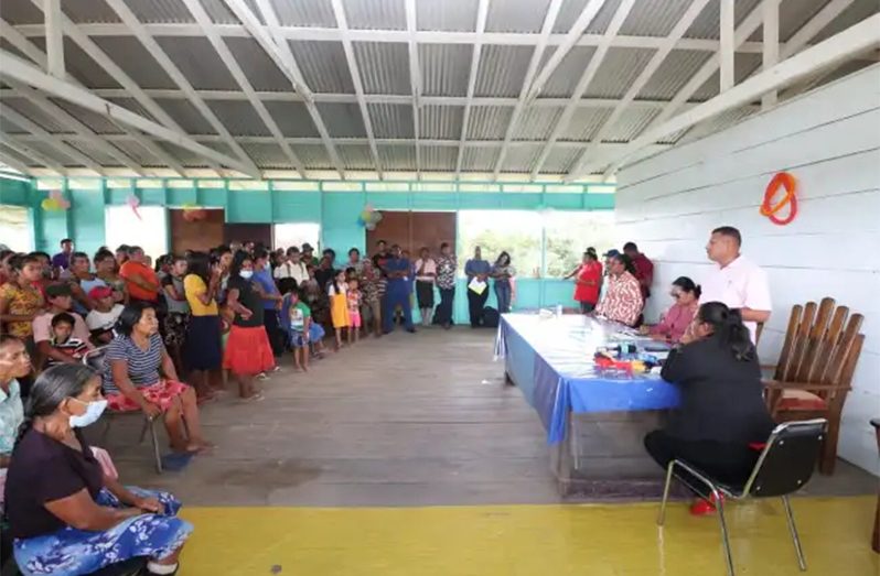 Residents of Baramita raising their concerns with Minister of Housing and Water Collin Croal, and Minister of Amerindian Affairs Pauline Sukhai