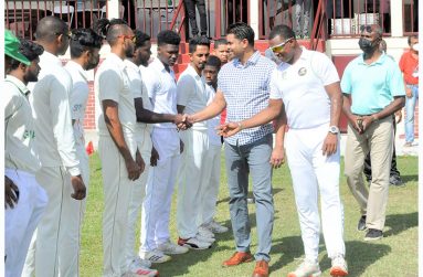Minister Charles Ramson (Jr) is introduced to the DCC team by skipper Chris Barnwell. GCA president Neil Barry (right) shares the moment (Sean Devers photo)