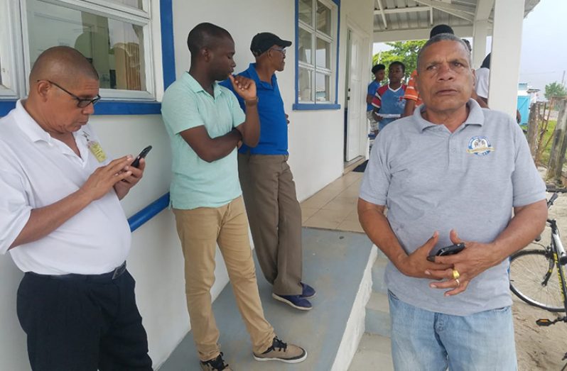 Minister of Social Cohesion, Dr. George Norton, Mayor of Bartica, Gifford Marshall and Region Seven Chairman, Gordon Bradford standing outside the GPL office in Bartica