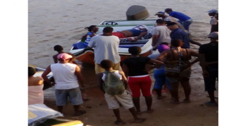 One of the injured men being taken to the Bartica Hospital via speedboat Saturday after the accident (Photo courtesy of Demerara waves)