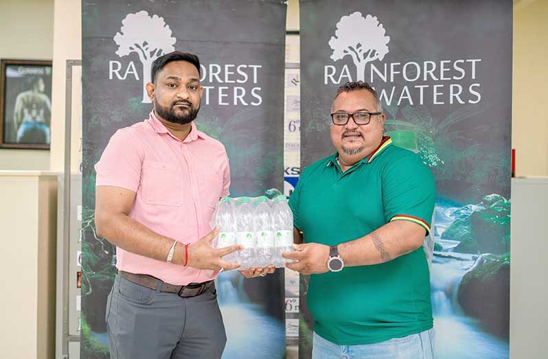 Basant Ramsarup (left), Brand Manager for Water Beverages at Banks DIH Limited and John Ramsingh of FL Sport
