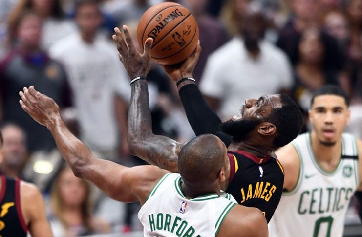 Cleveland Cavaliers forward LeBron James (23) drives to the basket against Boston Celtics forward Al Horford (42) during the fourth quarter in game six of the Eastern conference finals of the 2018 NBA Playoffs at Quicken Loans Arena. (Mandatory Credit: Ken Blaze-USA TODAY Sports)