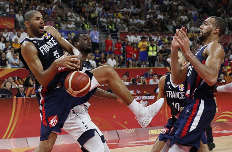 France's Nicolas Batum and Rudy Gobert in action at Dongguan Basketball Center, Dongguan, China. (REUTERS/Kim Kyung-Hoon)
