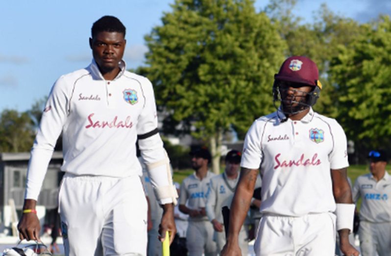 Alzarri Joseph (left) and Jermaine Blackwood leave the field at the close of day three following their century stand.