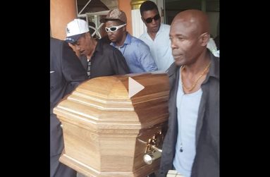 The body of the late Lennox Beckles  being borne out of  the Sandy’s Funeral Home on Chapel Street, Lodge