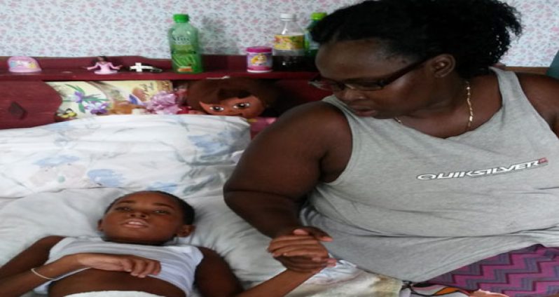 Bedridden: Colleacia and her mom Shonetta at their home yesterday