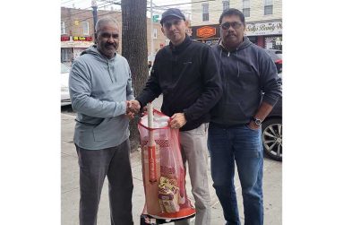 Derek Kallicharran, Harrischan Kamal and Anil Beharry pose with the donation.