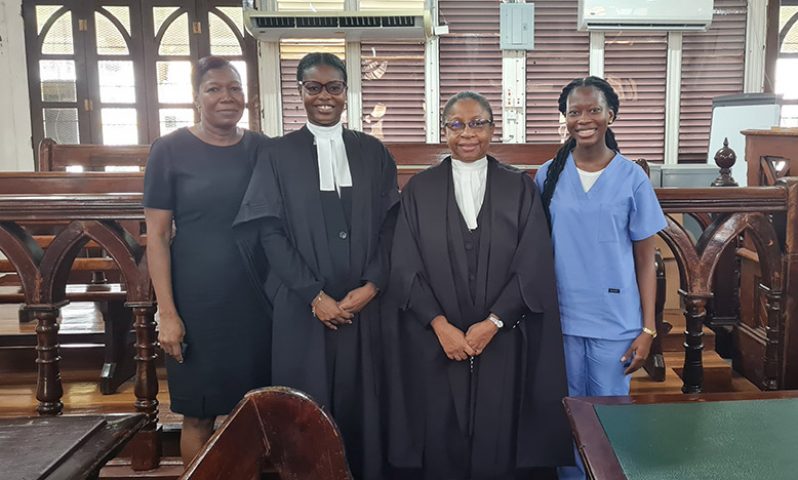 Attorney-at-law Nicklin Belgrave (second from left) poses with (from left) her mother, Faith Angel, Chief Justice (ag) Roxane George, and her sister, Lynceia Angel