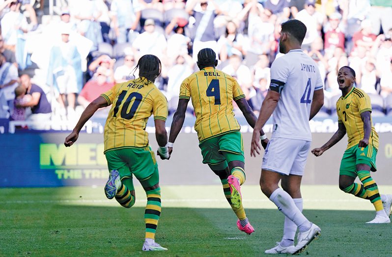 Jamaica Reggae Boyz goal scorer Amari’i Bell (4) celebrates with teammates Bobby Reid (10) and Leon Bailey (7) after scoring against Guatemala in the quarterfinals of the Concacaf Gold Cup on Sunday in the United States. (Concacaf photo)
