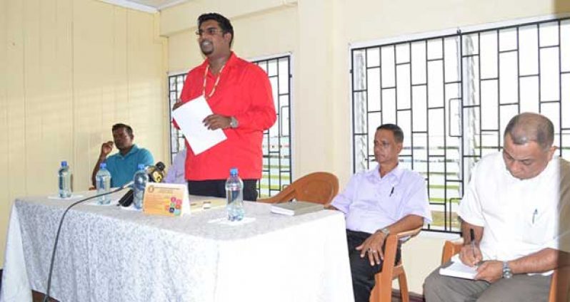 Minister Irfaan Ali addresses residents of Belle West, Canal No. 2. Sitting at the head table are other officials of Region 3