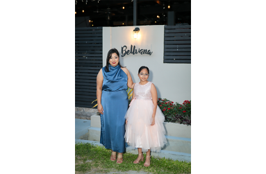 Nirvana Mahase and her daughter Arabella stand in front of Café Bellvana