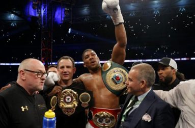Anthony Joshua celebrates with trainer Robert McCracken after winning the fight(Action Images via Reuters / Andrew Couldridge Livepic)