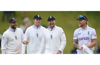 Ben Stokes, right, and jubilant England players celebrate their emphatic victory