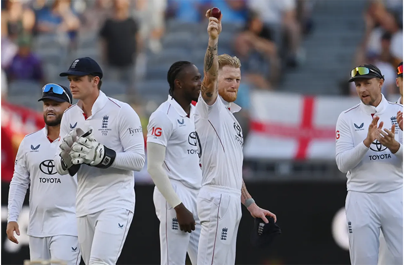 Ben Stokes holds the ball aloft after claiming a five-for  •  Getty Images