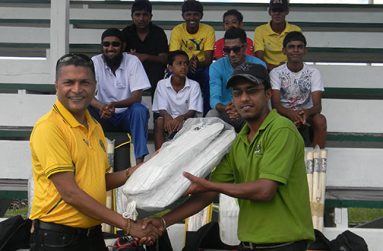 Safraz Ali, Industrial Welfare Officer and Committee Development Officer of Rose Hall Estate (right), receiving the kit from GCB Secretary, Anand Sanasie.
