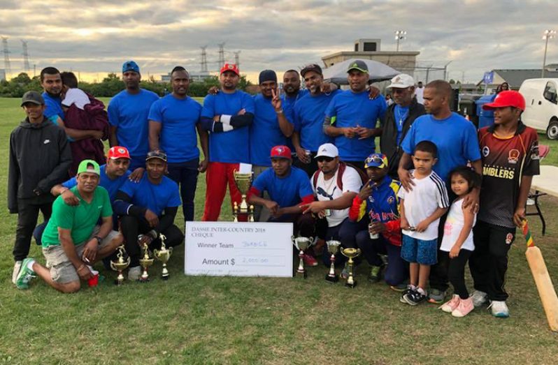 The victorious Berbice team and supporters after their victory over Demerara