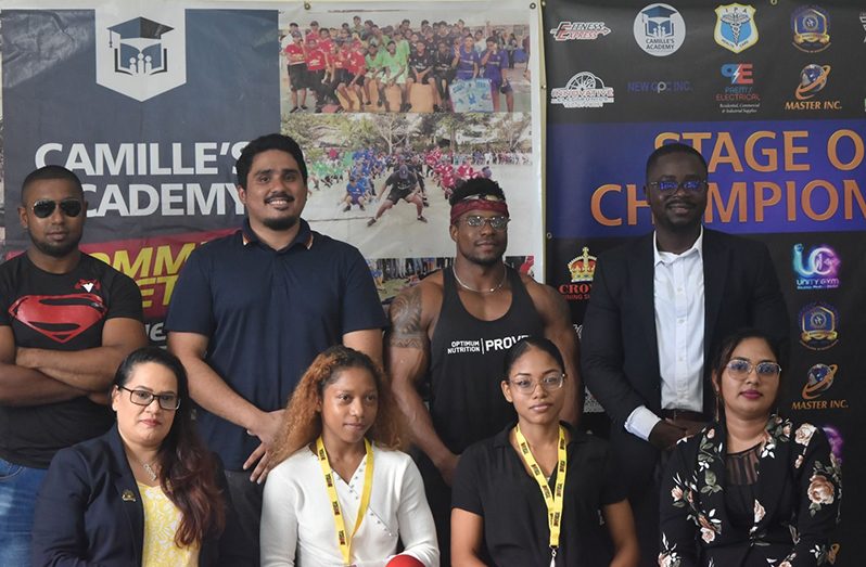 Head of the GBBF; Keavon Bess (standing far right) along with athletes and corporate sponsors at the launch last Tuesday