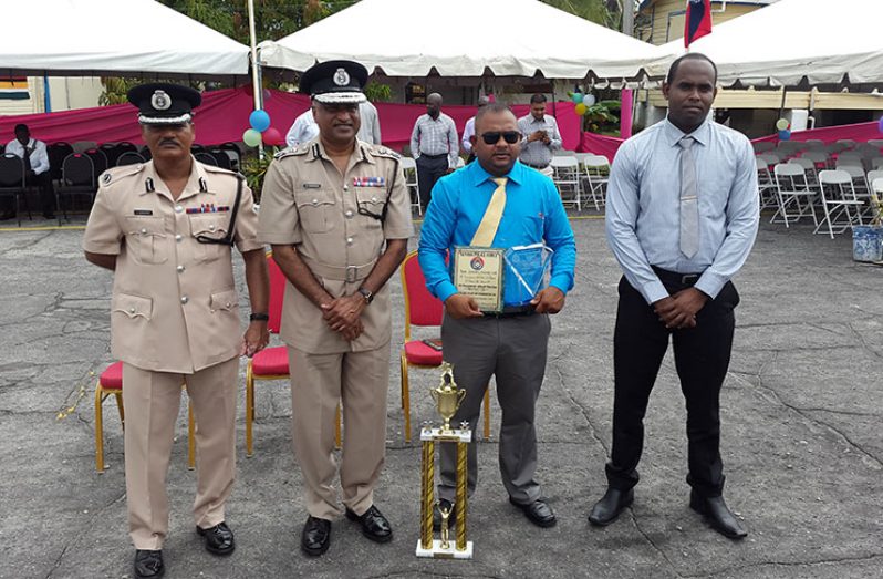 From left: Assistant Commissioner David Ramnarine, Commissioner Seelall Persaud, overall Best Cop Detective Corporal Pream Narine and Crime Chief Wendell Blanhum after the award ceremony