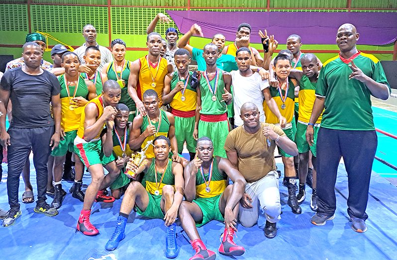 GDF retained their Best Gym title as Best Coach Terrence Poole (standing at right) leads the celebrations. (Sean Devers photo)