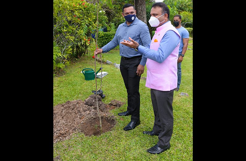 Minister of Natural Resources, Vickram Bharrat joins Indian High Commissioner, Dr. K.J. Srinivasa in planting a tree at the Promenade Gardens, in observance of World Environment Day 2021
