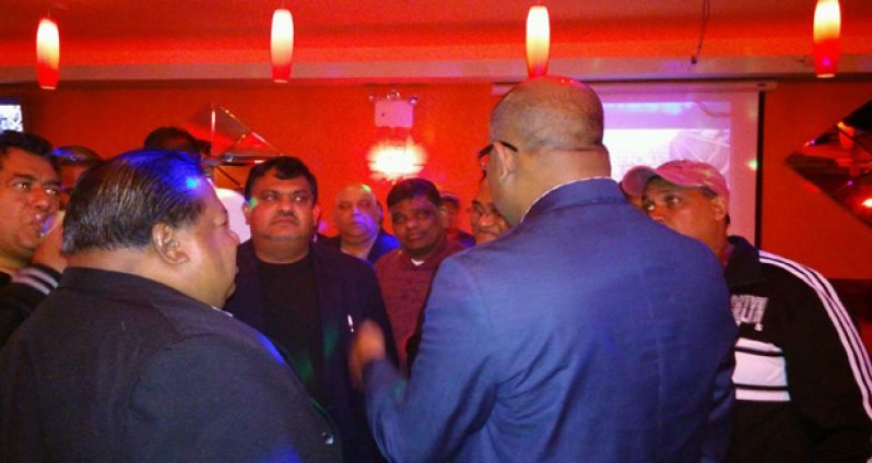 Opposition Leader Bharrat Jagdeo conversing with a few of the overseas-based Guyanese who were present at the meeting in Queens, NY