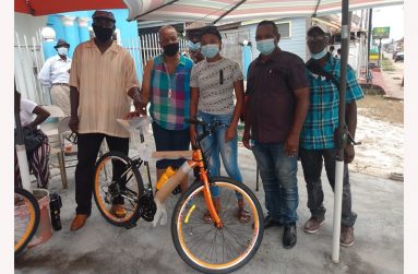 From left: Mark Greenville, Mrs Pamela Butcher, Jade Simmons who was presented with the bicycle, Andrew Forsythe and Compton Parkinson.