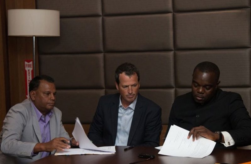 From left: Danny Ramnarain, President of Danco; Alberto De Losada, Chief Executive Officer (CEO) of CSM; and Eusi Anderson of Director Rogue Seven Incorporated, during the signing of the agreement at the Princess Ramada Hotel (DPI photo)