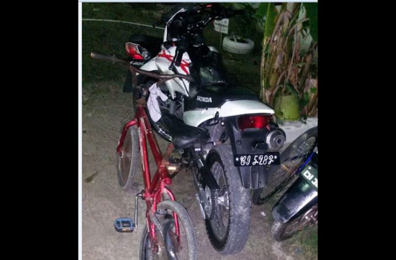 The abandoned motorcycle and the damaged pedal cycle after the accident.