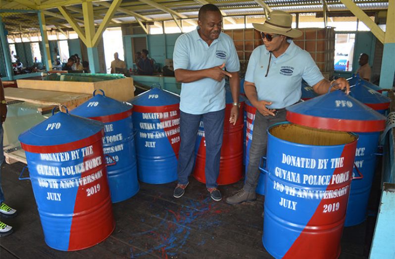 Finance Officer, Senior Superintendent Michael Sutton and his deputy, Superintendent Marcelene Washington, inspecting the bins that were distributed on the seawall behind Eve Leary