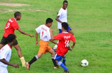 Chronicle Sport photographer Adrian Narine was on hand at the Georgetown Football Club ground, to catch a piece of the action between Bishops’ High (red) and St Joseph High which the former won 4-1.