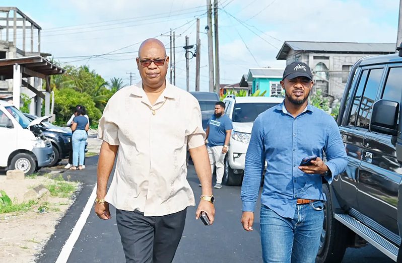 Minister of Public Works, Juan Edghill, alongside Head of the Department of Special Projects Unit, Colling Gittens, inspecting roads in Diamond