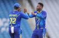 Joshua Bishop of the Barbados Pelicans (right) celebrates a wicket with Shian Brathwaite during their match against the Jamaica Titans (Photo courtesy CWI Media)