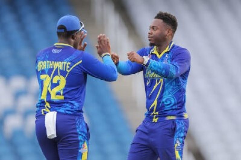 Joshua Bishop of the Barbados Pelicans (right) celebrates a wicket with Shian Brathwaite during their match against the Jamaica Titans (Photo courtesy CWI Media)