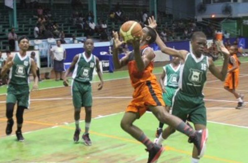Action in the U-14 semi-finals between Kwakwani Secondary and Bishops’ High on Saturday night.