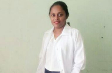 Dr. Bissoon in her coat and poised to help