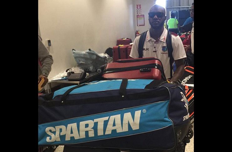Batsman Jermaine Blackwood pushes his luggage following his arrival yesterday. (Photo courtesy CWI Media)