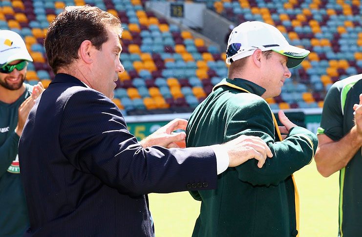 Steve Smith is presented his Captain's Blazer   by former Test captain  Mark Taylor in 2014.
