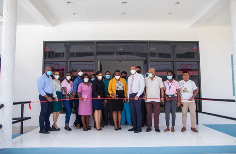 Regional Health Officer (RHO) of Region Three, Dr Erica Forte, supported by Health Minister Dr Frank Anthony and other officials cut the ribbon to declare open the new blood bank (DPI photo)