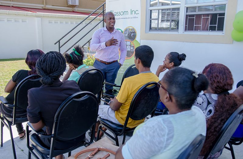 Dr. Astell Collins addressing the parents and children on Wednesday (Photo by Delano Williams)