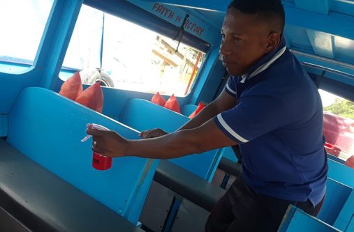 A boat operator taking measures