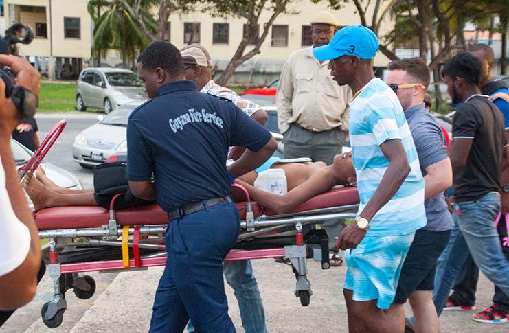 The Guyana Fire Service Emergency Medical Technicians (EMTs) who tried to resuscitate the teenager in the presence of his father and sister at the Seawall Bandstand. (Delano Williams Photo)