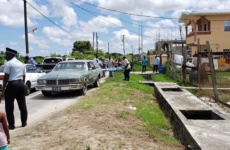 Justin Peterkin’s body being removed from the premises where he was killed on Monday morning.