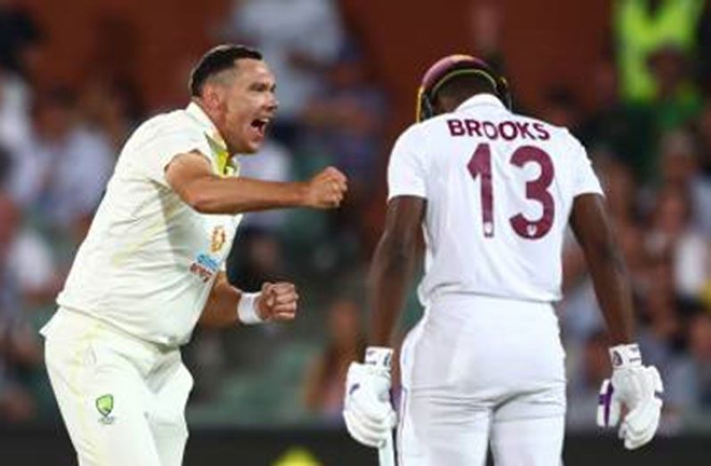 Shamarh Brooks is forlorn as Scott Boland celebrates his wicket yesterday, the third day of the second Test.