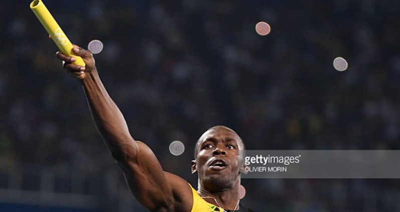 Jamaica's Usain Bolt celebrates after Team Jamaica won the Men's 4x100m Relay Final during the athletics event at the Rio 2016 Olympic Games at the Olympic Stadium in Rio de Janeiro last night. / AFP / OLIVIER MORIN (Photo credit should read OLIVIER MORIN/AFP/Getty Images)