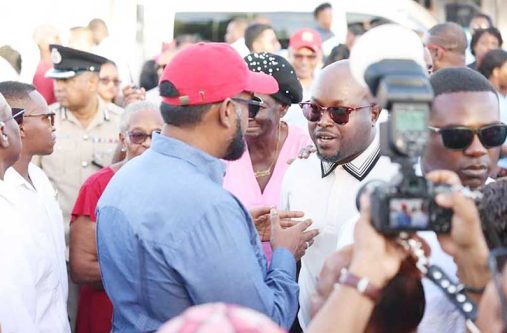 PNC-R’s James Bond engaging with President, Dr. Irfaan Ali, during a community engagement on Thursday